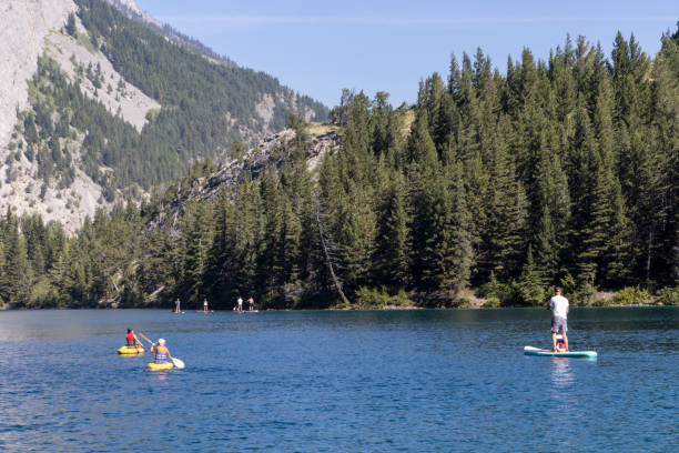 istock Family SUPing, tranquil lake 2171805601
