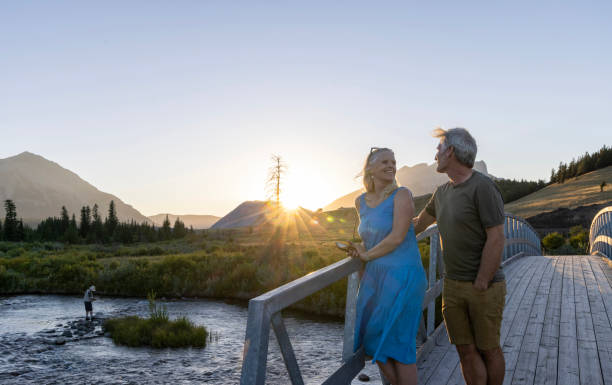 istock Mature couple take photo from bridge at sunset 2171805603