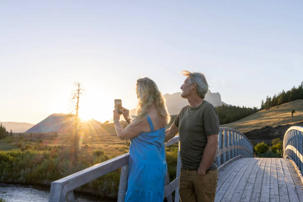 istock Mature couple take photo from bridge at sunset 2171805697