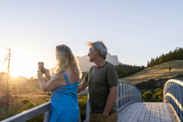 istock Mature couple take photo from bridge at sunset 2171805699