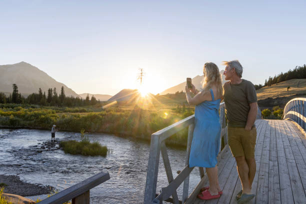 istock Mature couple take photo from bridge at sunset 2171805735