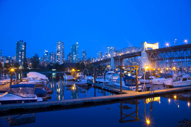 A harbor ferry in False Creek near downtown Vancouver's Yaletown District. British Columbia, Canada.