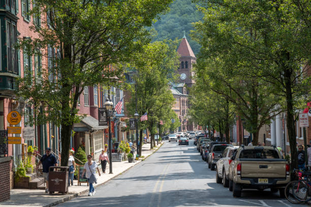 Jim Thorpe, USA - August 24, 2024. Tourists walking on sidewalk in downtown Jim Thorpe, Pennsylvania, USA
