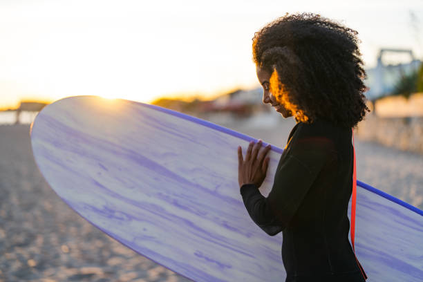 istock Joyful Black Female Surfer with Board at Beach 2171818585