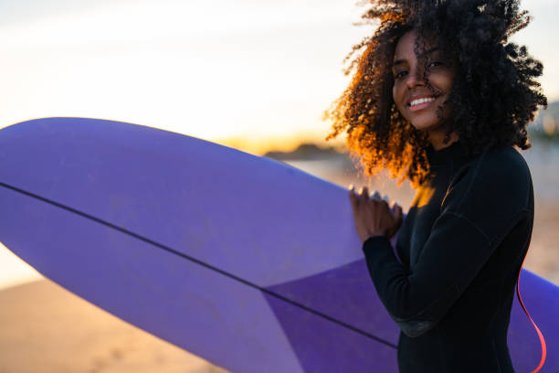 istock Joyful African American Surfer with Board at Sunset Beach 2171818593
