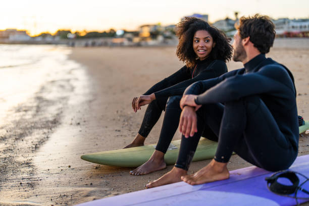 istock Interracial Couple Enjoying Sunset Beach Retreat 2171818612