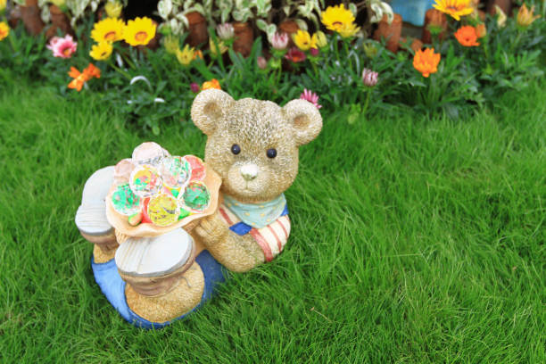 TEDDY BEAR brown color with scarf on the grass