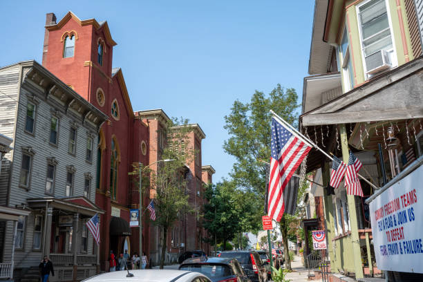 Jim Thorpe, USA - August 24, 2024. Tourists walking on sidewalk in downtown Jim Thorpe, Pennsylvania, USA