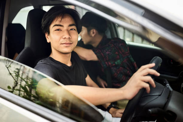 istock Taxi driver and passenger having a glance inside the vehicle 2171837100