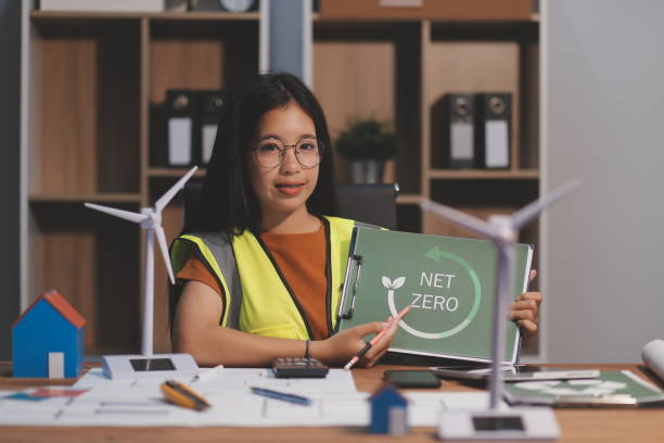 istock Female architect working at home She looked at the blueprint. 2171843585