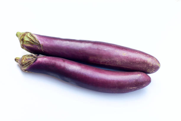 istock Two purple eggplants or aubergines isolated on white background 2171844695