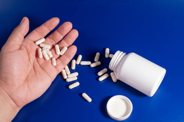 istock Hand of a person who comitted suicide with sleeping tablets 2171847661