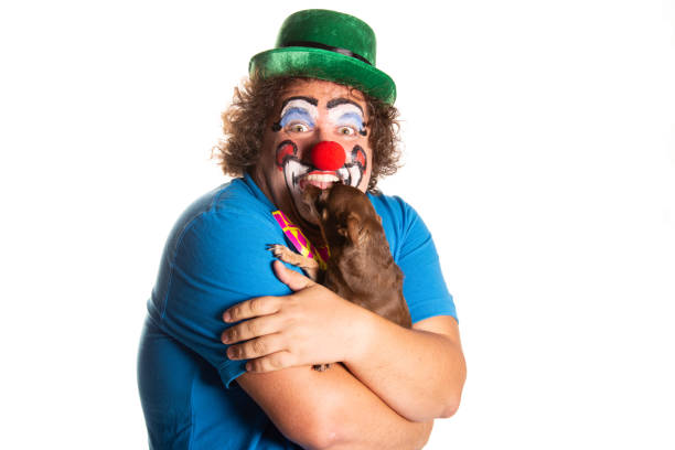 istock Funny fat clown posing on a white background. 2171856563