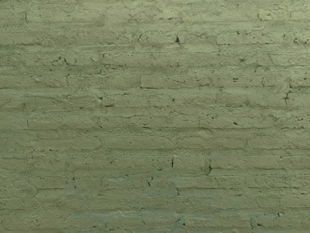 istock Texture of an old brick wall painted green 2171860127