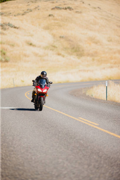 istock Motorcyclist Riding Motorcycle On a Summer Day 2171868525