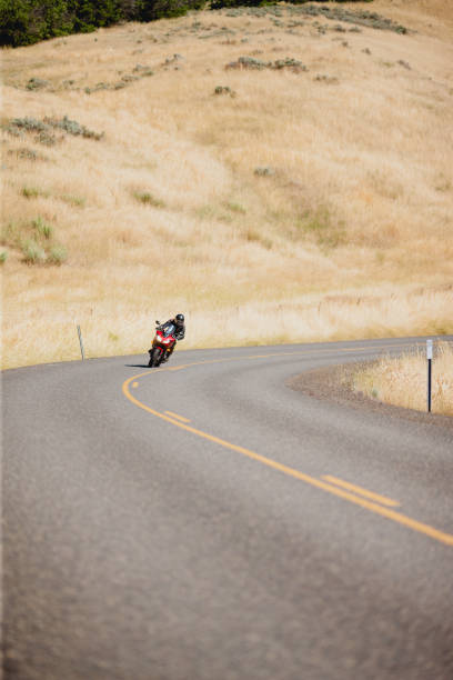 istock Motorcyclist Riding Motorcycle On a Summer Day 2171868539