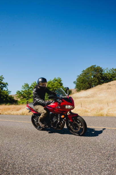 istock Motorcyclist Riding Motorcycle On a Summer Day 2171868553