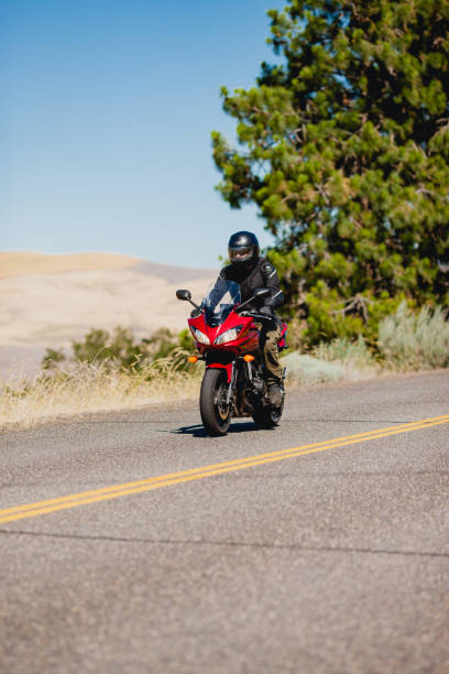 istock Motorcyclist Riding Motorcycle On a Summer Day 2171868582