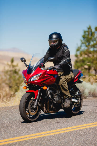 istock Motorcyclist Riding Motorcycle On a Summer Day 2171868583