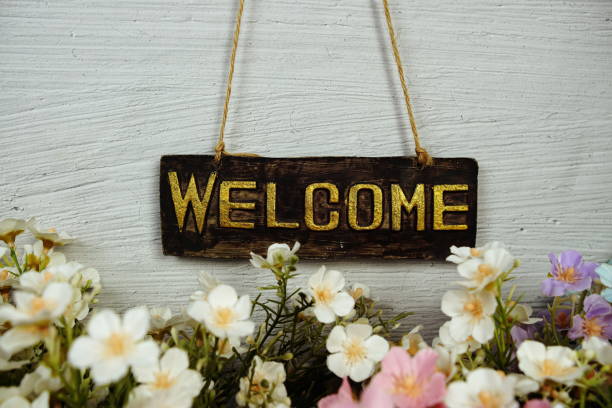 istock Welcome sign Hanging on grunge cement wall background 2171873538