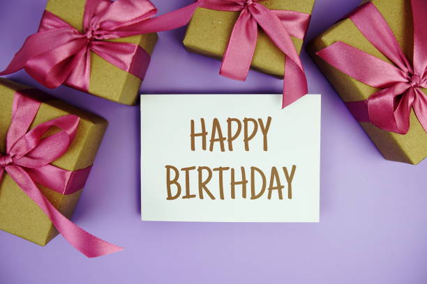 istock Happy Birthday card with gift box presents on purple background 2171873697
