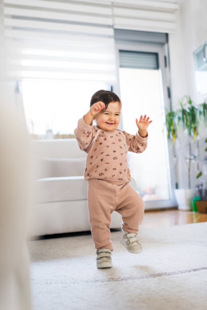 istock First steps of baby girl 2171880692