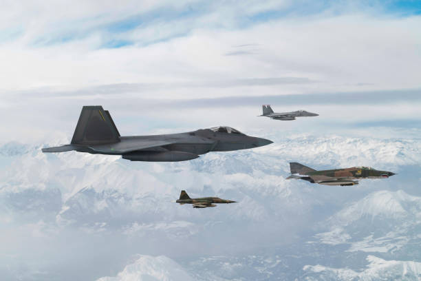 istock Jet fighters flying over snowcapped mountains. 2171883555