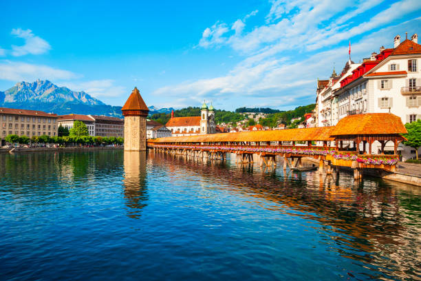 Kapellbrucke Bridge, Wasserturm Tower, Lucerne Kapellbrucke or Chapel Bridge is a wooden footbridge spanning Reuss river and Wasserturm water tower in Lucerne city, central Switzerland lucerne switzerland stock pictures, royalty-free photos & images