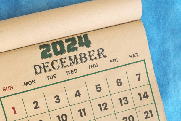 istock December 2024 calendar flat lay in blue background with copy space. 2171884255