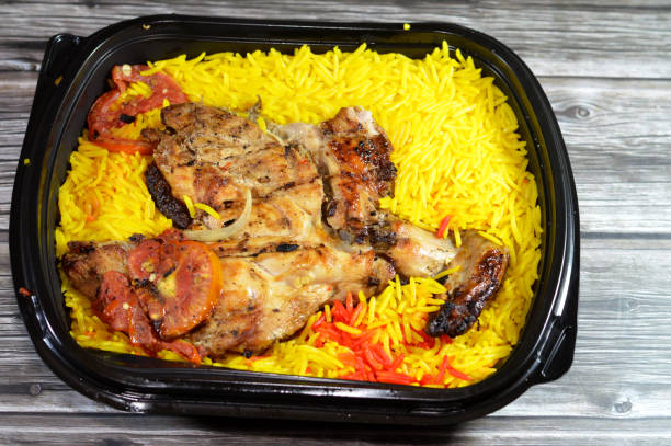 Arabian cuisine of charcoal grilled barbecued chicken with colorful Basmati rice