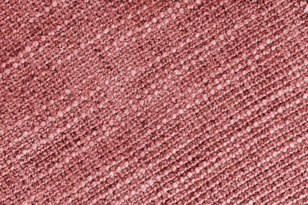 Jacquard diagonal woven coarse weave texture upholstery red fabric background Jacquard diagonal woven coarse weave texture upholstery red fabric. Textile background, furniture textile material, wallpaper, backdrop. Cloth structure close up, macro. red cushion covers stock pictures, royalty-free photos & images
