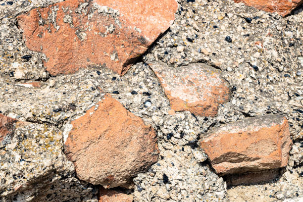 red and black tuff stones bonded with mortar with rubble and Armenian obsidian in stone of in Erebuni Fortress in Yerevan city on sunny summer day