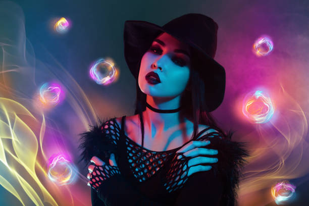 istock Surreal artwork collage of lady witch hug herself over magical background with glowing bubbles 2171899561