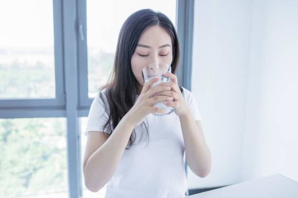 istock Asian woman drinking milk 2171904827