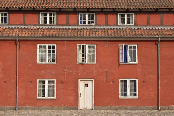 Historic half-timbered architecture in a serene European city street with cobblestones, shop displays, and a timeless atmosphere of charm and tradition in this picturesque urban setting.