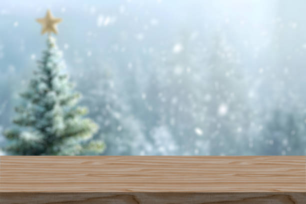 istock Empty table in front of christmas tree with decorations background. For product display montage in winter with snow. Merry Christmas concept. 2171906583
