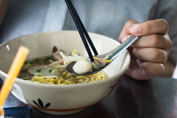 istock Eating Thai Noodle Soup with Fish Ball and Bean Sprouts 2171909448