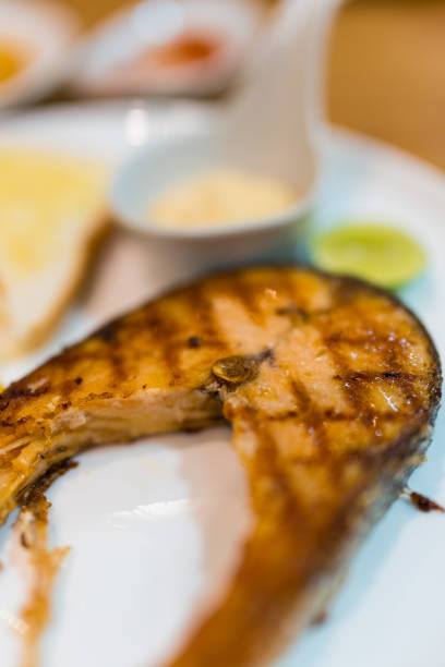 Grilled trout on the plate in a restaurant.