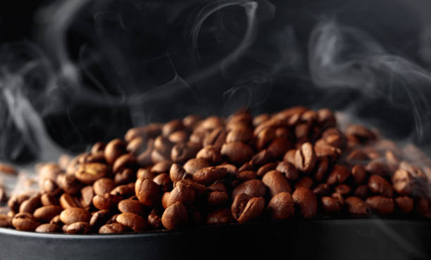 istock Steaming coffee beans on a black background. 2171916068