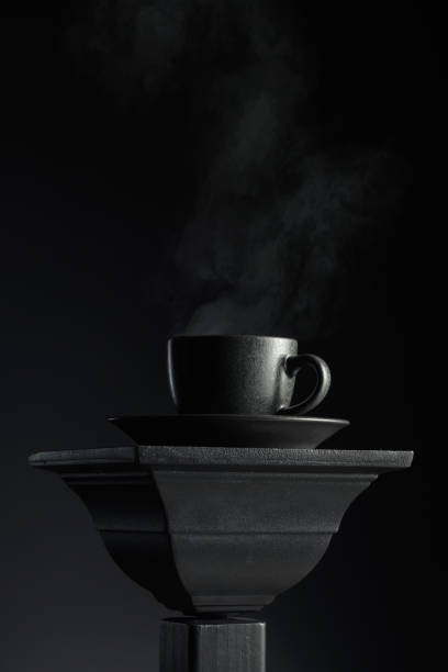 istock Black cup of coffee on a black background. 2171916070