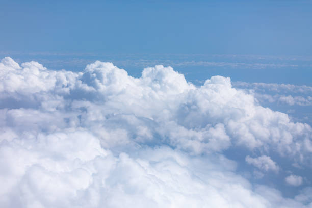 istock Blue sky serves as a beautiful backdrop for the fluffy white clouds 2171916961