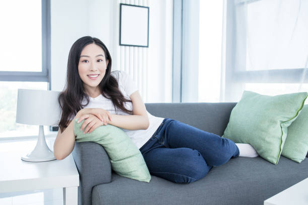 istock Young woman with soft pillow at home 2171923074