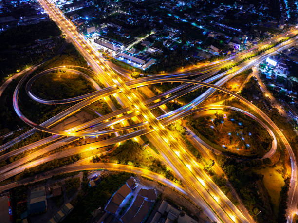 istock Expressway top view, Road traffic an important infrastructure, Drone aerial view fly in circle, traffic transportation, Public transport or commuter city life concept of economic and energ, transport. 2171950298