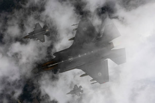 istock Jet fighters flying over the clouds. 2171950540