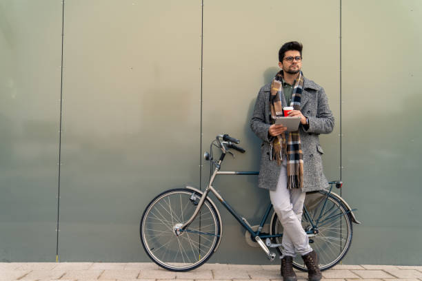 istock Modern Businessman with Bicycle and Tablet 2171953993