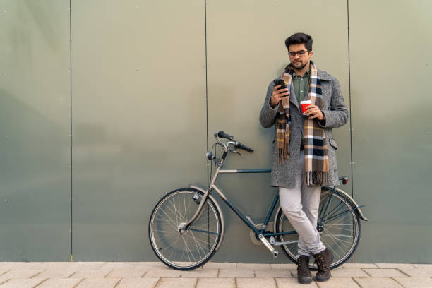 istock Caucasian Businessman with Bicycle on Break Using Smartphone 2171954004