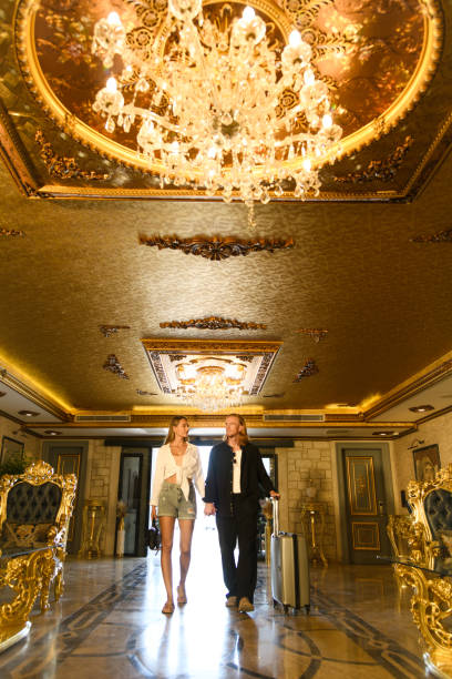 istock Couple Entering Luxurious Hotel Lobby 2171955713