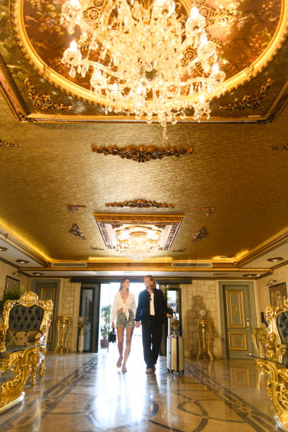 istock Couple Entering Luxurious Hotel Lobby 2171955714