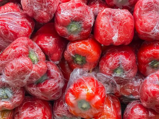 istock Fresh red Bell Peppers in Plastic Wrap 2171956193