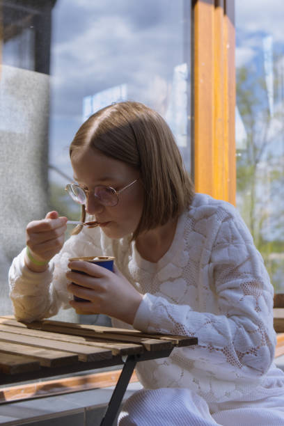 istock A girl in a cafe 2171956666